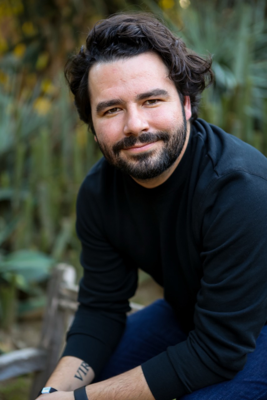 Tyler John Bianco seated outdoors